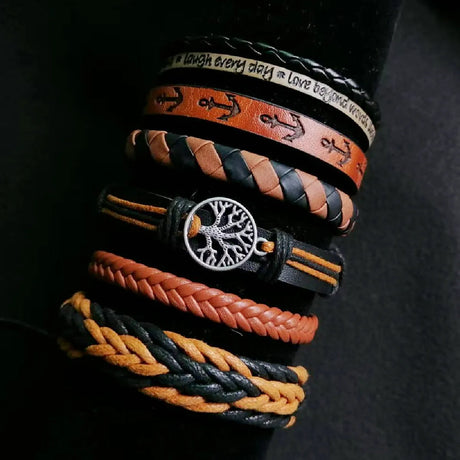 Collection of braided leather bracelets with various designs on a dark background