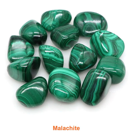 Collection of green malachite stones on a white background