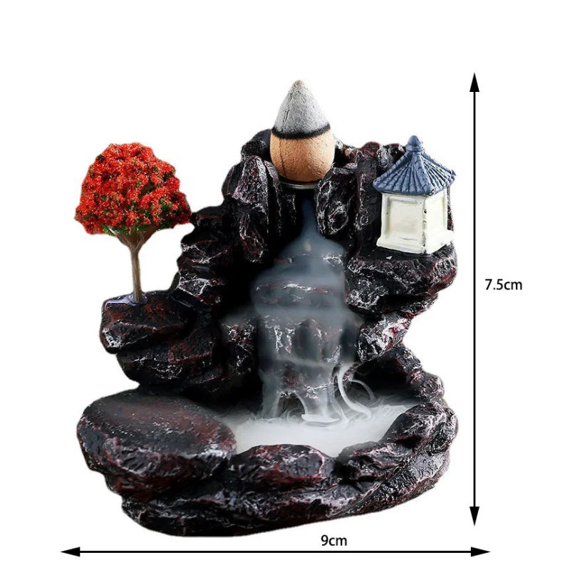 Decorative mist maker with a tree, lantern, and mountain design, featuring dimensions on a white background.