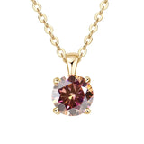 Gold necklace with a multicolored gemstone pendant on a white background