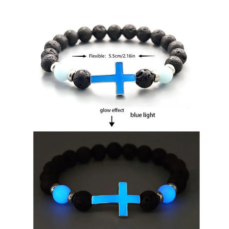 Bracelet with black and white beads and blue cross, showing flexible nature and glow effect.