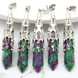 Five green and purple stone pendants with silver clasps on a white background
