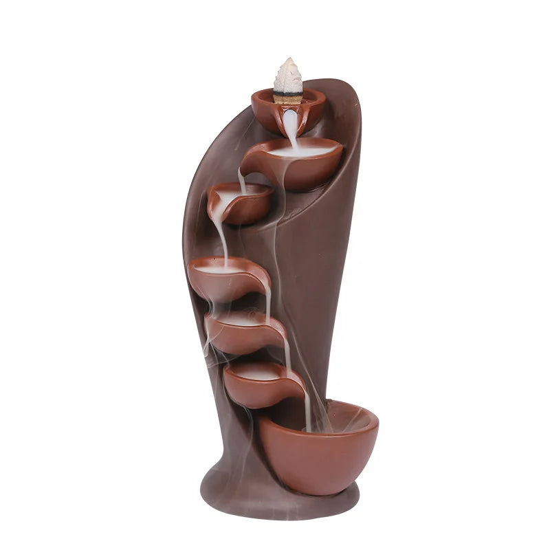 Decorative water fountain with brown and terracotta colors on a white background