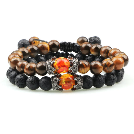 Set of three beaded bracelets with lava beads and orange gemstones on a white background