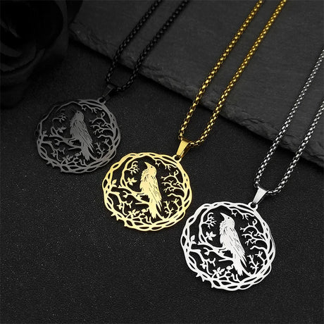 Three circular pendants with engraved designs on a dark surface