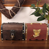 Two wooden treasure chests with decorative elements on a wooden surface.