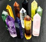 Collection of colorful crystal points on a dark textured background with AierCrystal branding.