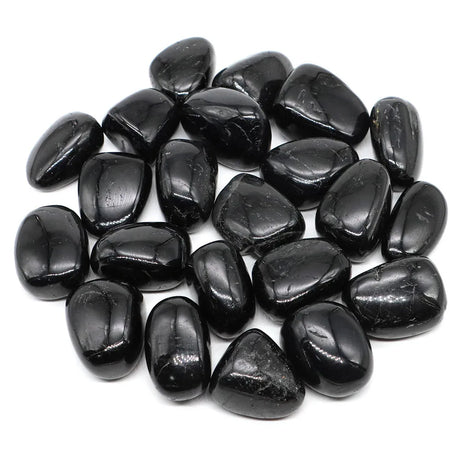 Collection of black stones on a white background