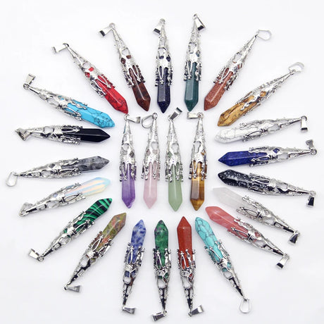 Collection of crystal wands in various colors and designs on a white background