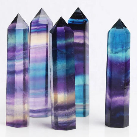 Set of colorful crystal towers on a white background