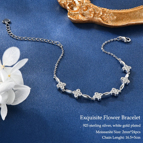 Silver bracelet with floral design on a blue background