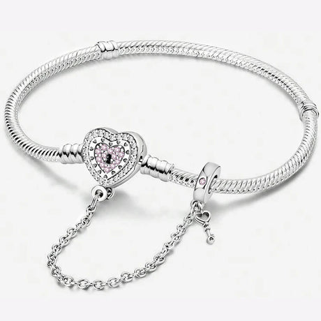 Silver bracelet with a heart-shaped charm on a white background