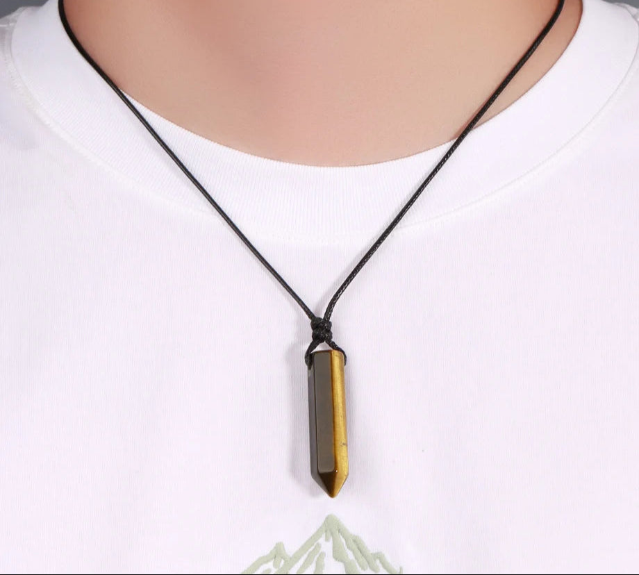 Necklace with a pendant on a mannequin wearing a white shirt, brand 'CIA' visible.