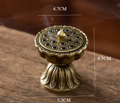 Bronze incense burner with dimensions on a wooden surface