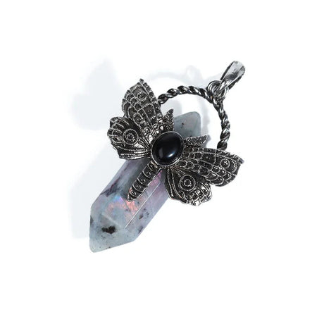 Jewelry pendant with butterfly design and black gemstone on a white background