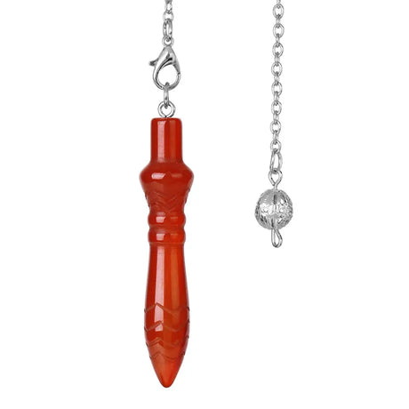 Red pendant on a silver chain against a white background