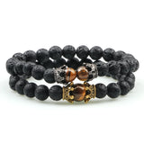 Black beaded bracelet with tiger eye stones on a white background