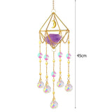 Decorative hanging crystal with geometric design and colorful beads on a white background