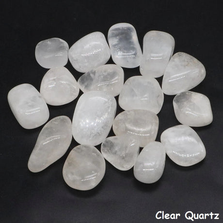 Clear quartz stones on a black background