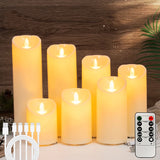 Set of LED candles with remote control on a wooden surface