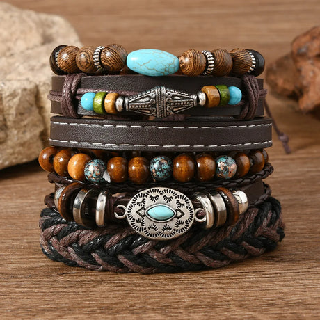 Stack of leather and beaded bracelets on a wooden surface