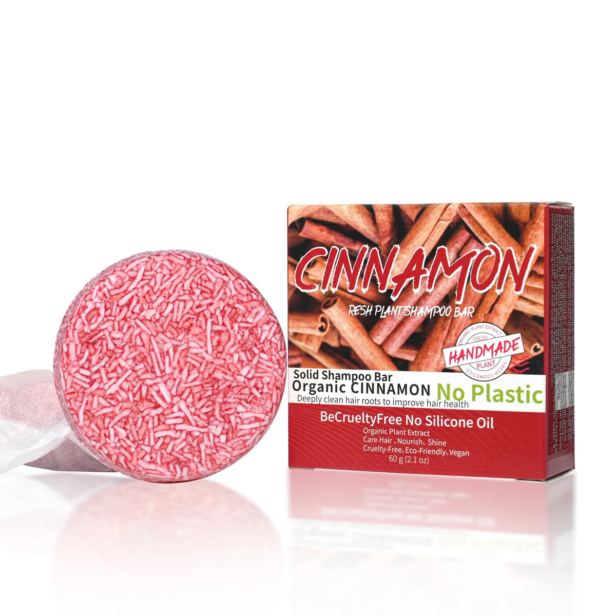 Pink solid shampoo bar with cinnamon flavor packaging on a white background