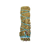Bundled sage with twine on a white background