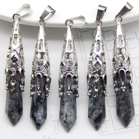 Five silver and stone pendants on a white background