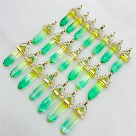 Green and yellow crystal-like pendants on a white background
