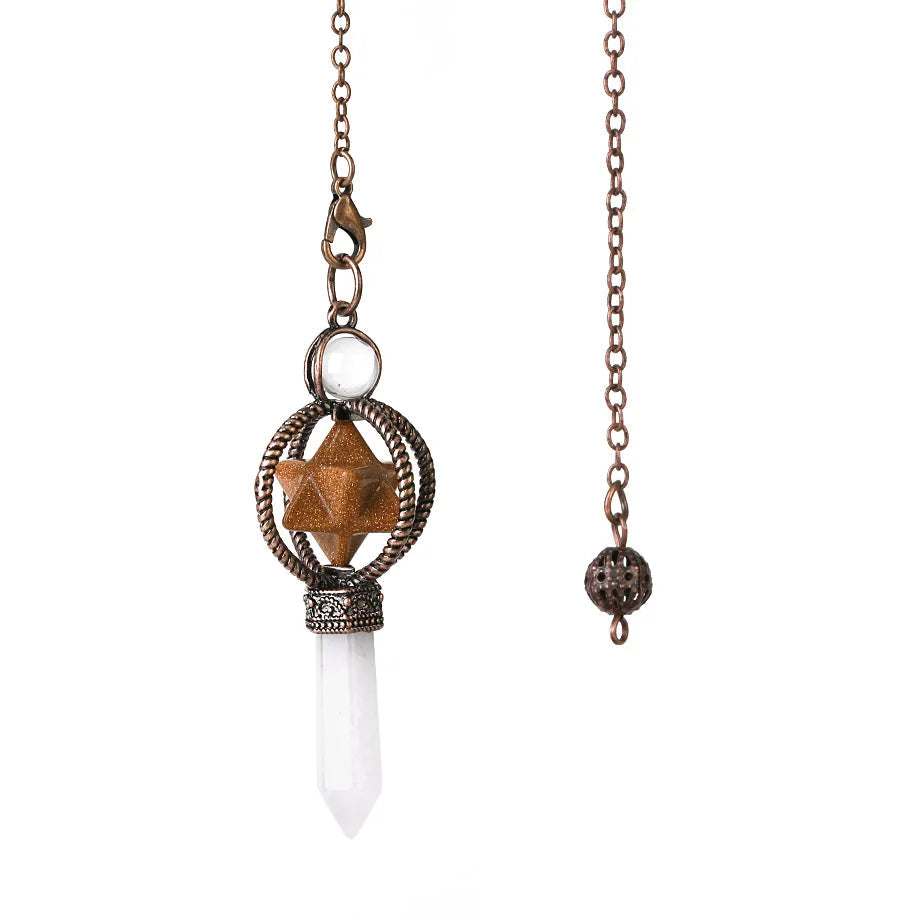 Necklace with star-shaped pendant and white crystal on a chain, brand 'Crista' visible.