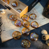 Set of crystal stones with engraved symbols on an open book
