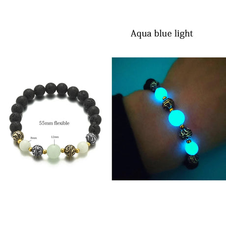 Black beaded bracelet with aqua blue light feature on a white background
