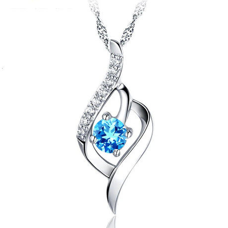 Silver necklace with a blue gemstone pendant on a white background, featuring the brand 'ZDADAN'.