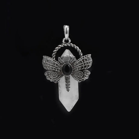 Silver pendant with dragonfly design on a black background