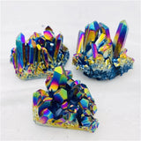 Three colorful crystal formations on a white background