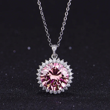 Necklace with a pink gemstone pendant on a black background