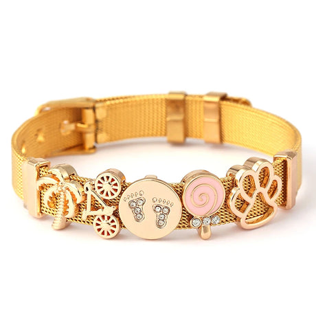 Gold bracelet with various charms on a white background