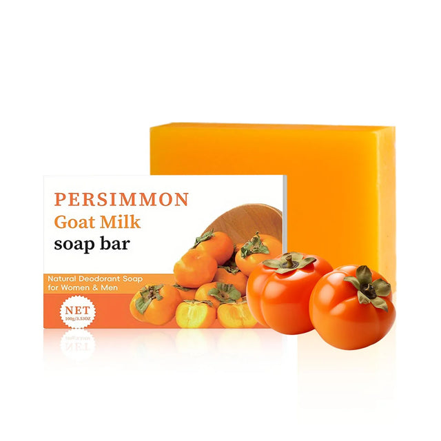 Persimmon goat milk soap bar with packaging on a white background