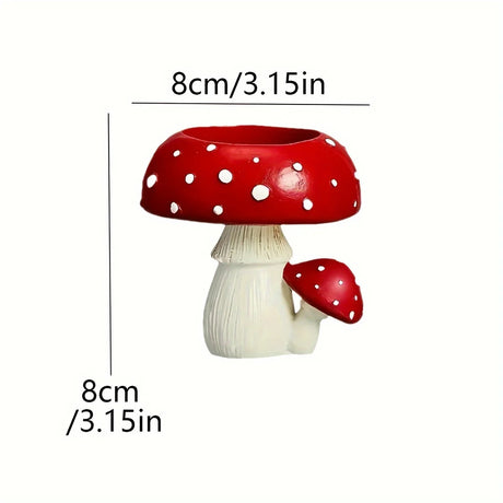 Mushroom-shaped planter with red cap and white spots, shown with measurements on a white background.