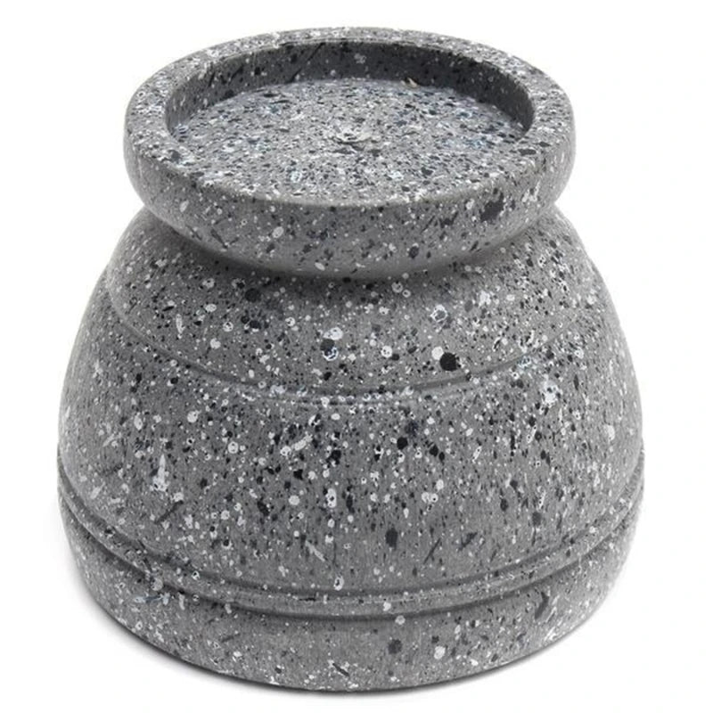 Speckled gray stone lantern on a white background