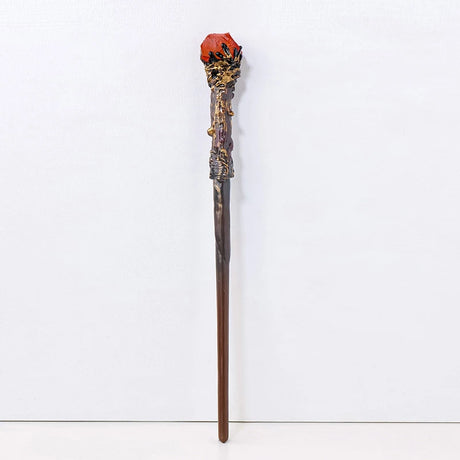 Decorative staff with a red top on a white background