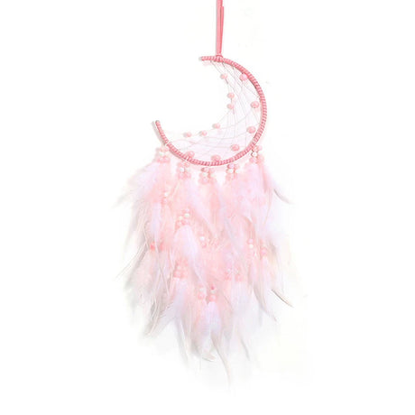 Pink dreamcatcher with feathers on a white background
