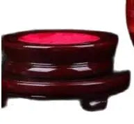 Wooden circular stand with a red cushion on a white background