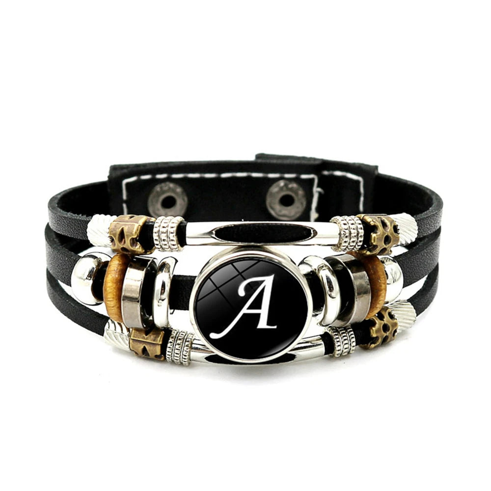 Multistrand leather bracelet with metal accents and a central black roundel with letter 'A'.