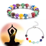 Colorful beaded bracelet with a silhouette of a person in a yoga pose and a silver bracelet.