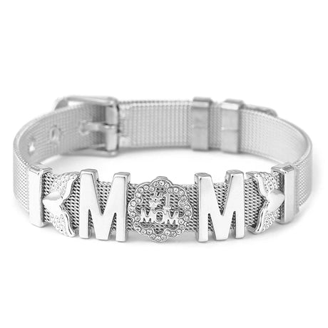 Silver dog collar with 'MOM' engraving on a white background