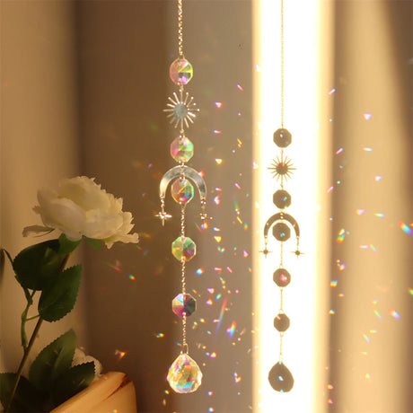 Decorative hanging crystal with rainbow, placed against a neutral background.