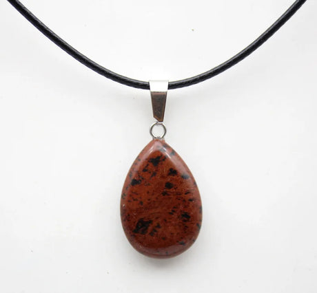 Teardrop-shaped pendant on a black cord against a white background