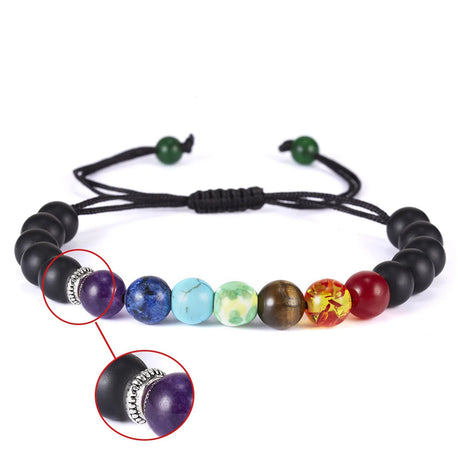 Multicolored beaded bracelet with a close-up of a purple bead and silver charm on a white background.