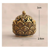 Bronze incense burner with intricate designs and measurements on a beige background